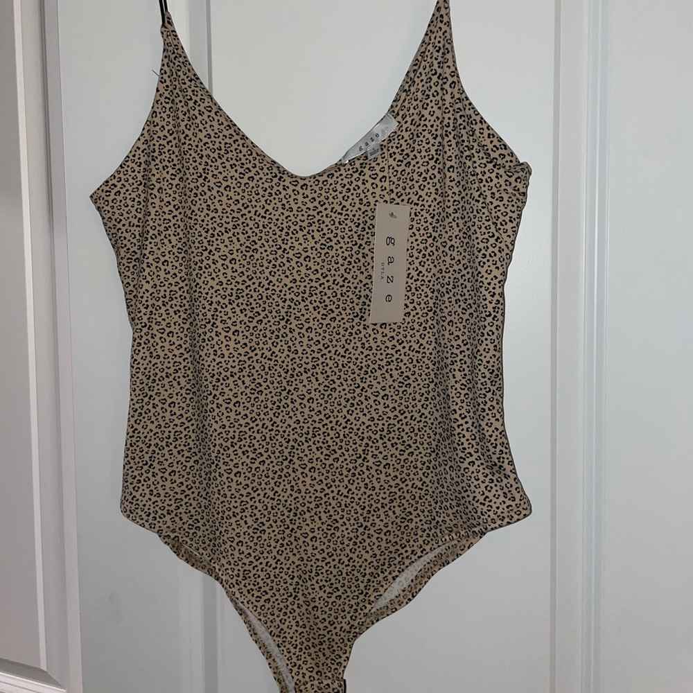 Size large leopard print body suit. NWT, never worn